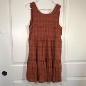 Cotton burnt orange dress with a tiered skirt.